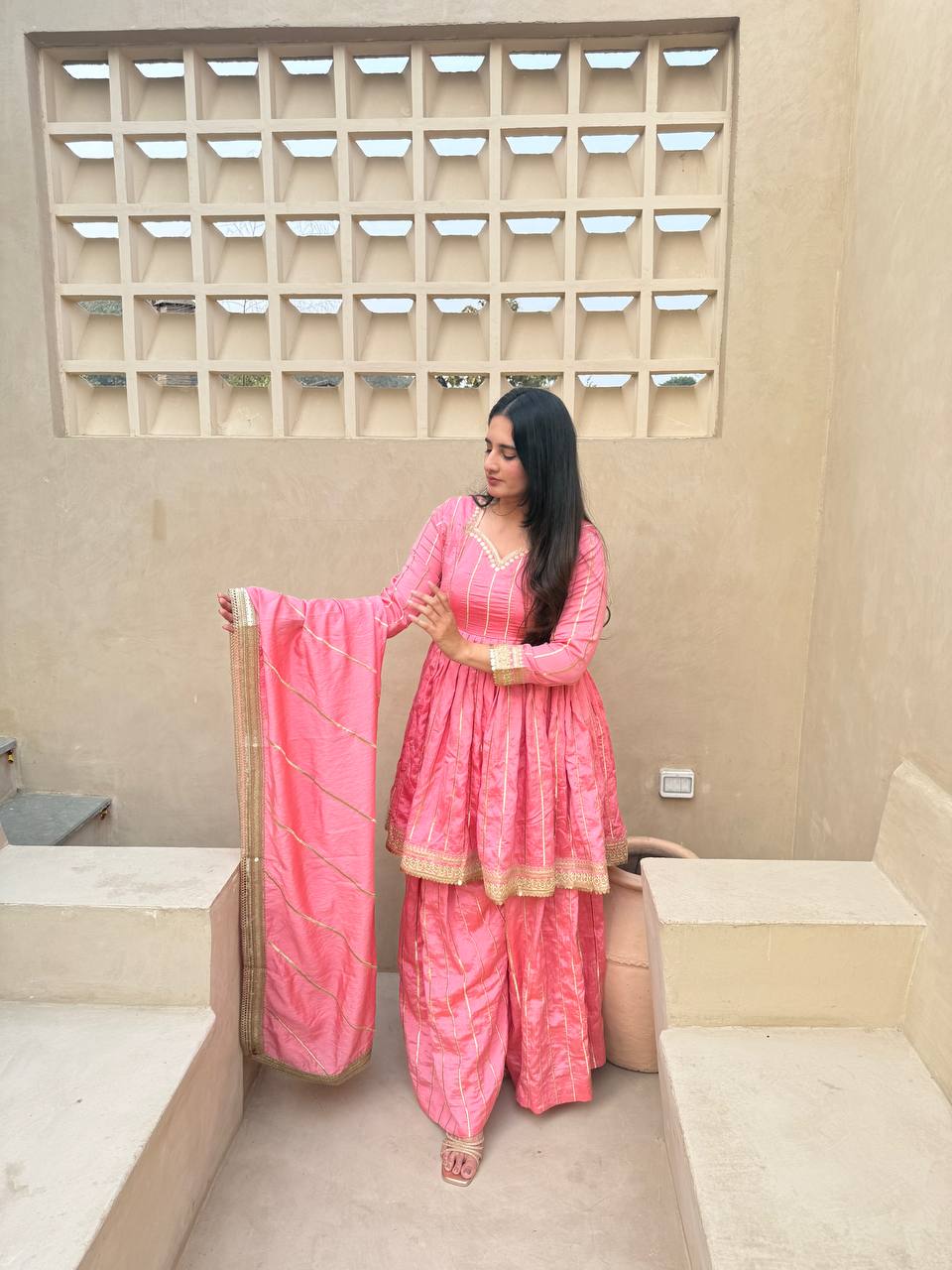 Radiant Rose Pink Flared Peplum Kurti and Sharara Set Embellished with Luminous Gold Zari Stripes and Sequined Borders